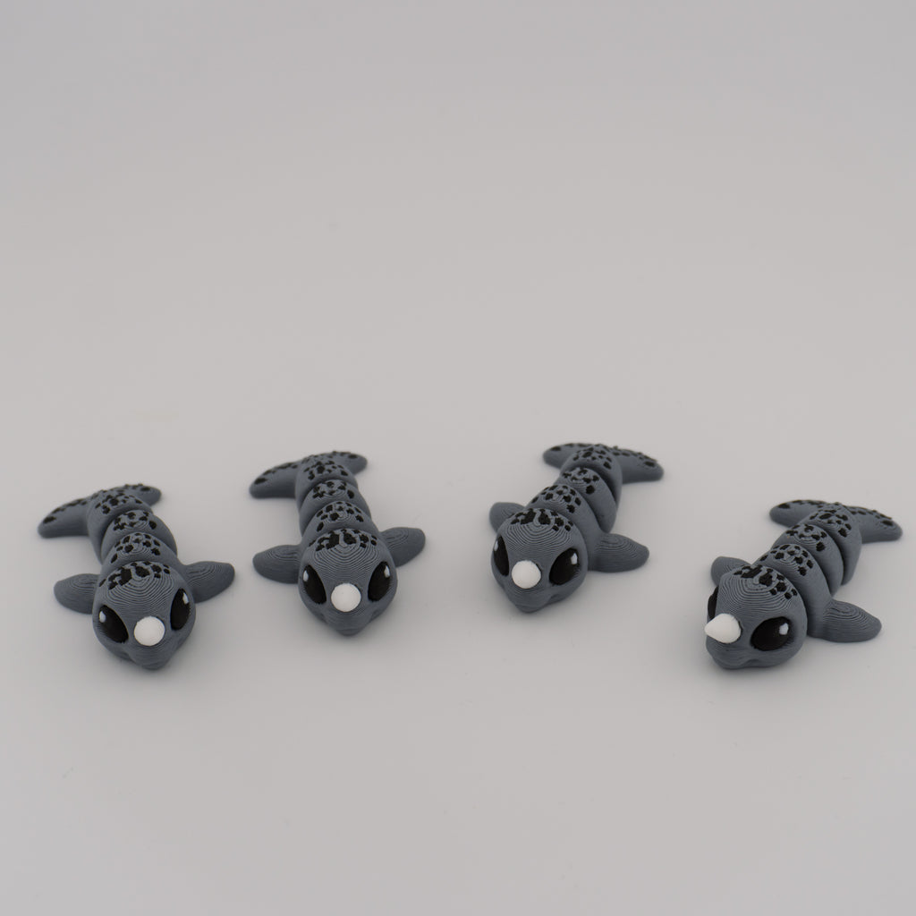 Flexi Narwhal Hatchling – Articulated Mini Sea Creature (Santa Hat or Regular)