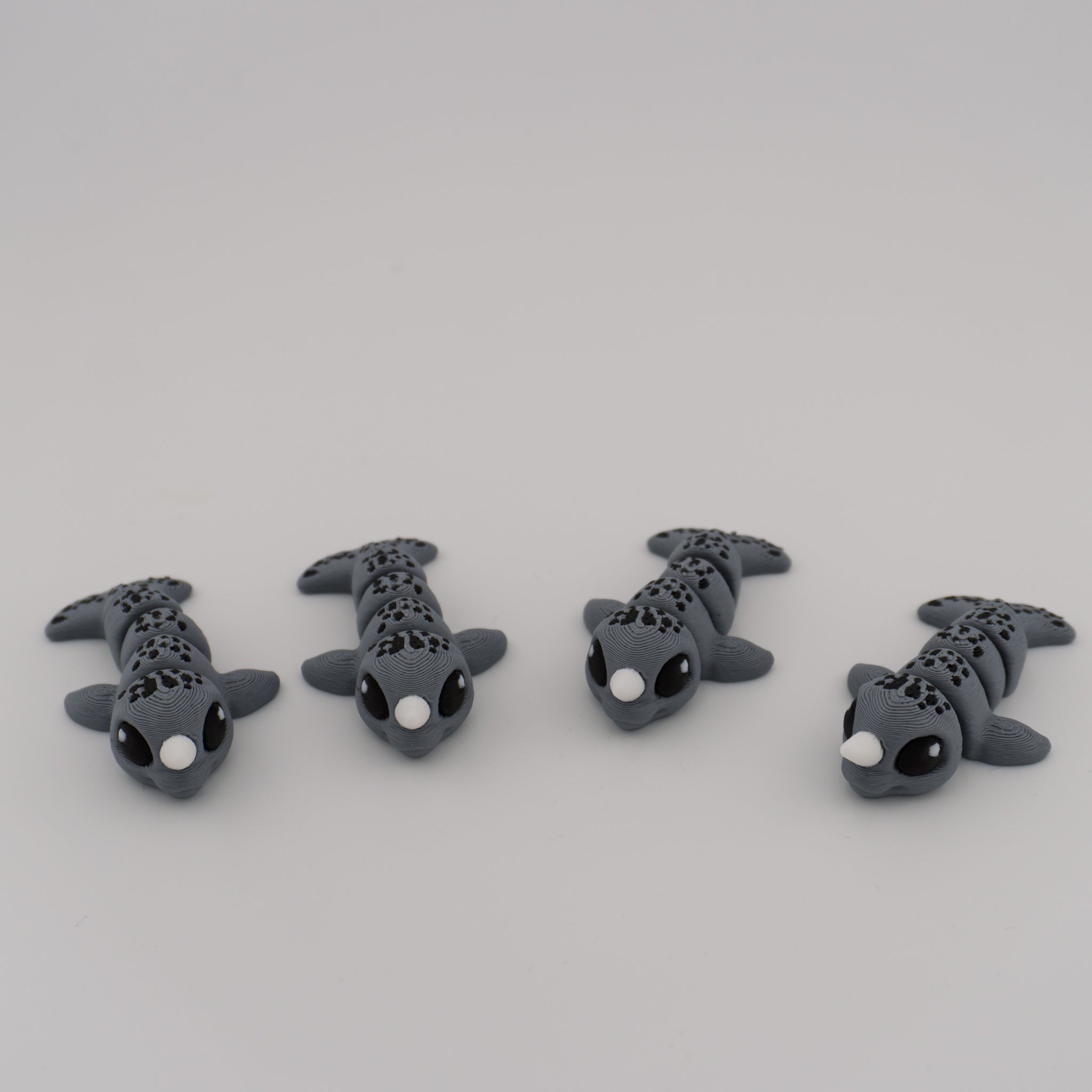 Flexi Narwhal Hatchling – Articulated Mini Sea Creature (Santa Hat or Regular)