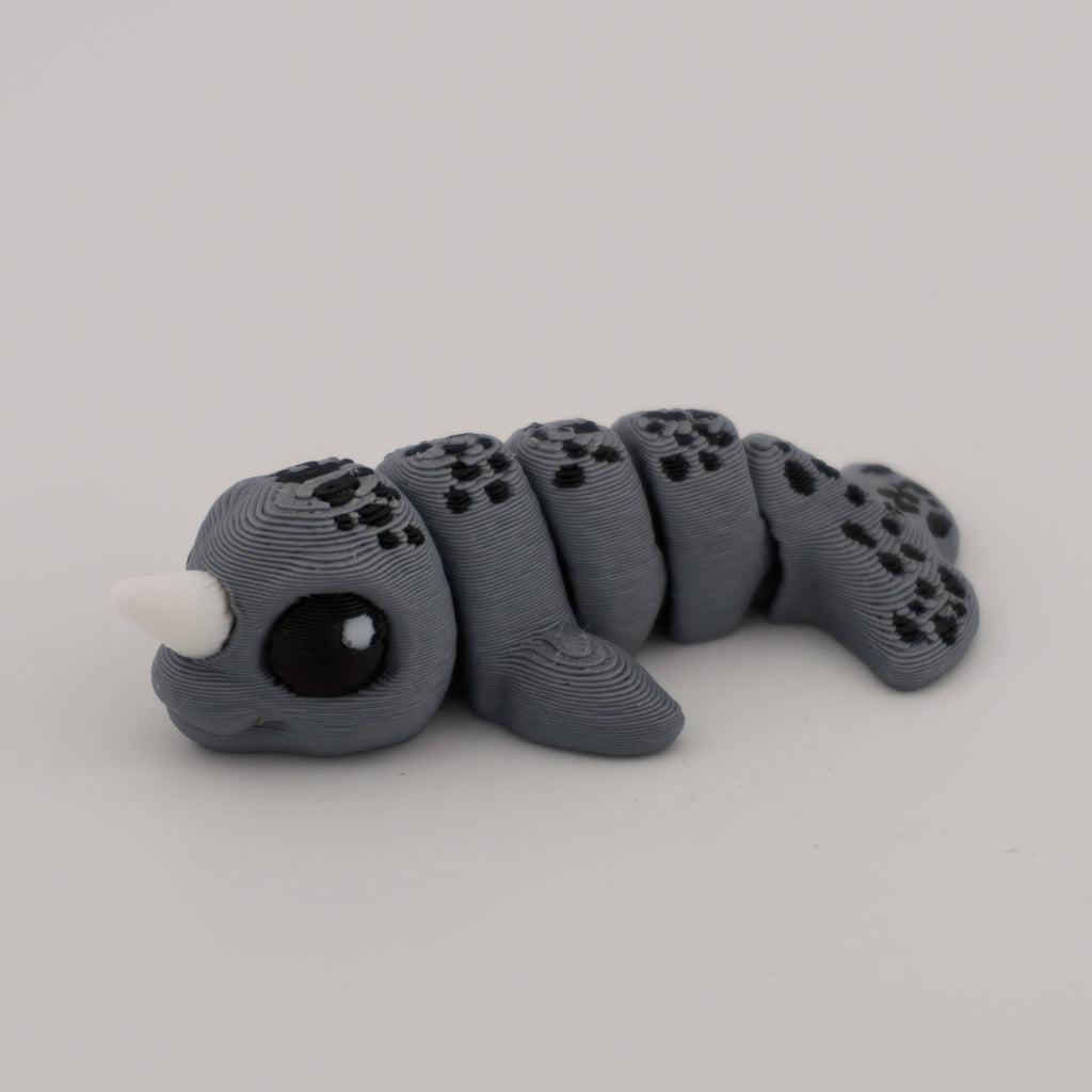 Flexi Narwhal Hatchling – Articulated Mini Sea Creature (Santa Hat or Regular)