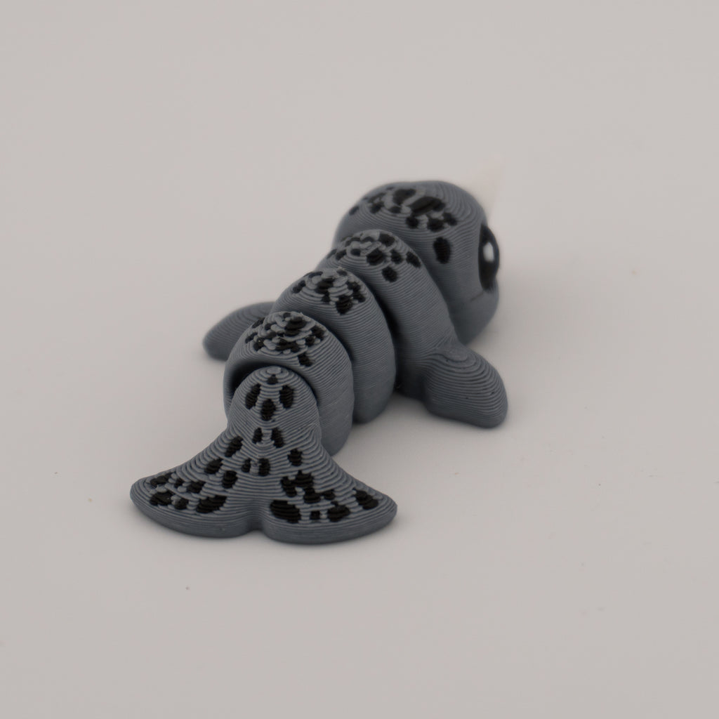 Flexi Narwhal Hatchling – Articulated Mini Sea Creature (Santa Hat or Regular)