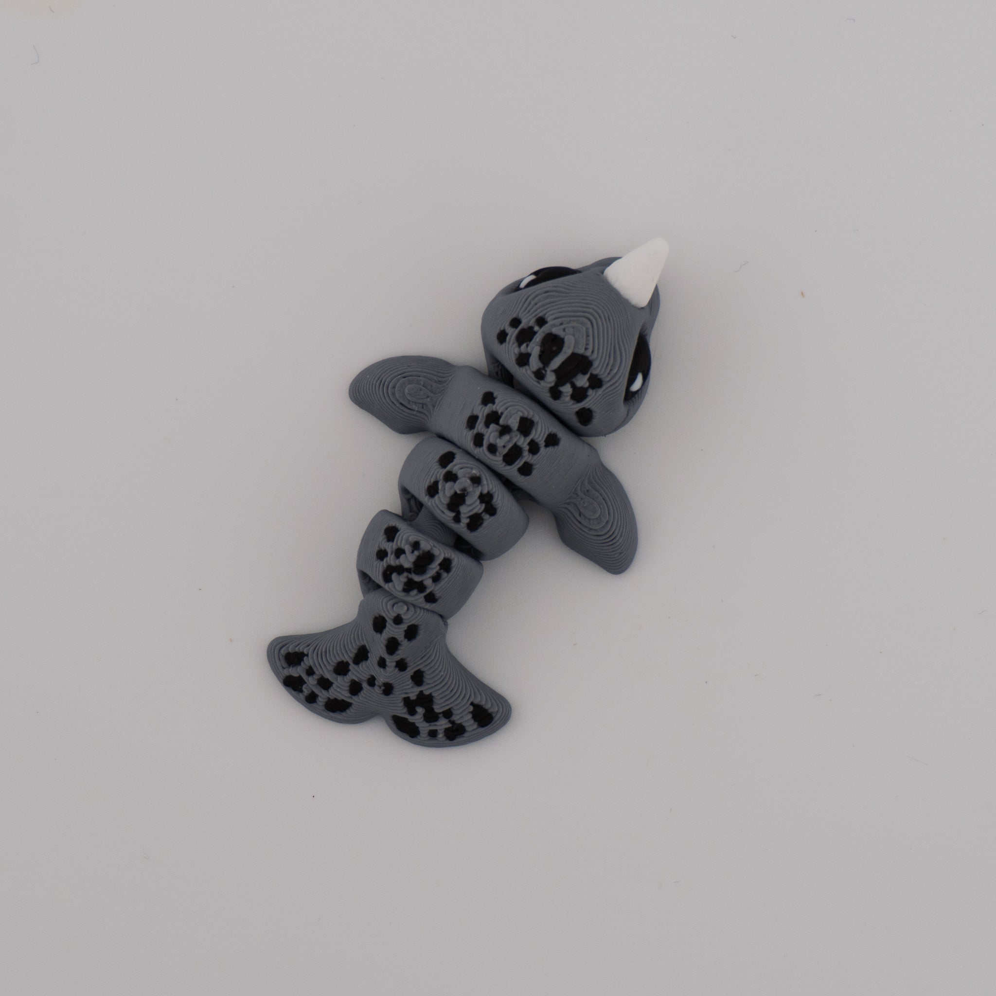 Flexi Narwhal Hatchling – Articulated Mini Sea Creature (Santa Hat or Regular)