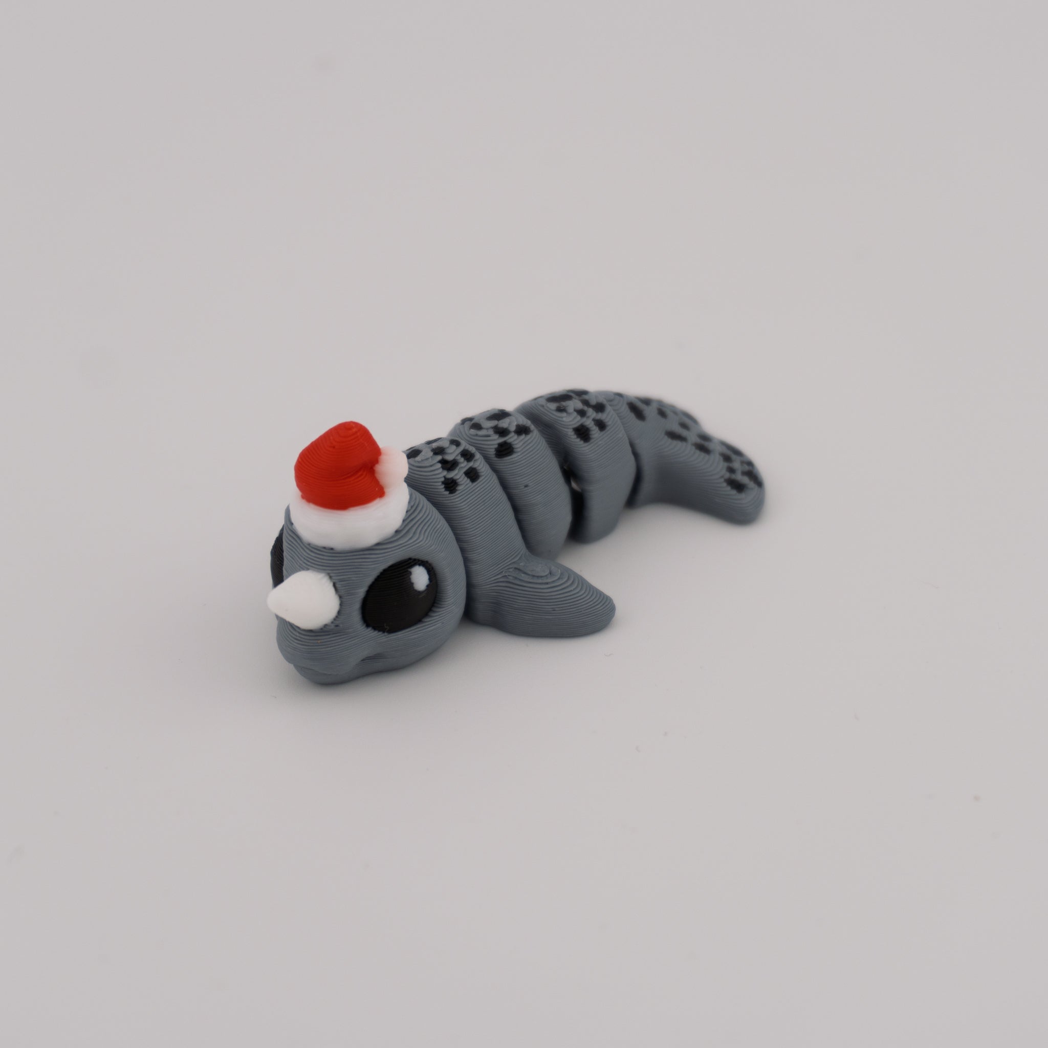Flexi Narwhal Hatchling – Articulated Mini Sea Creature (Santa Hat or Regular)
