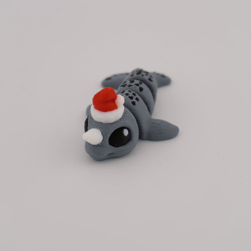 Flexi Narwhal Hatchling – Articulated Mini Sea Creature (Santa Hat or Regular)