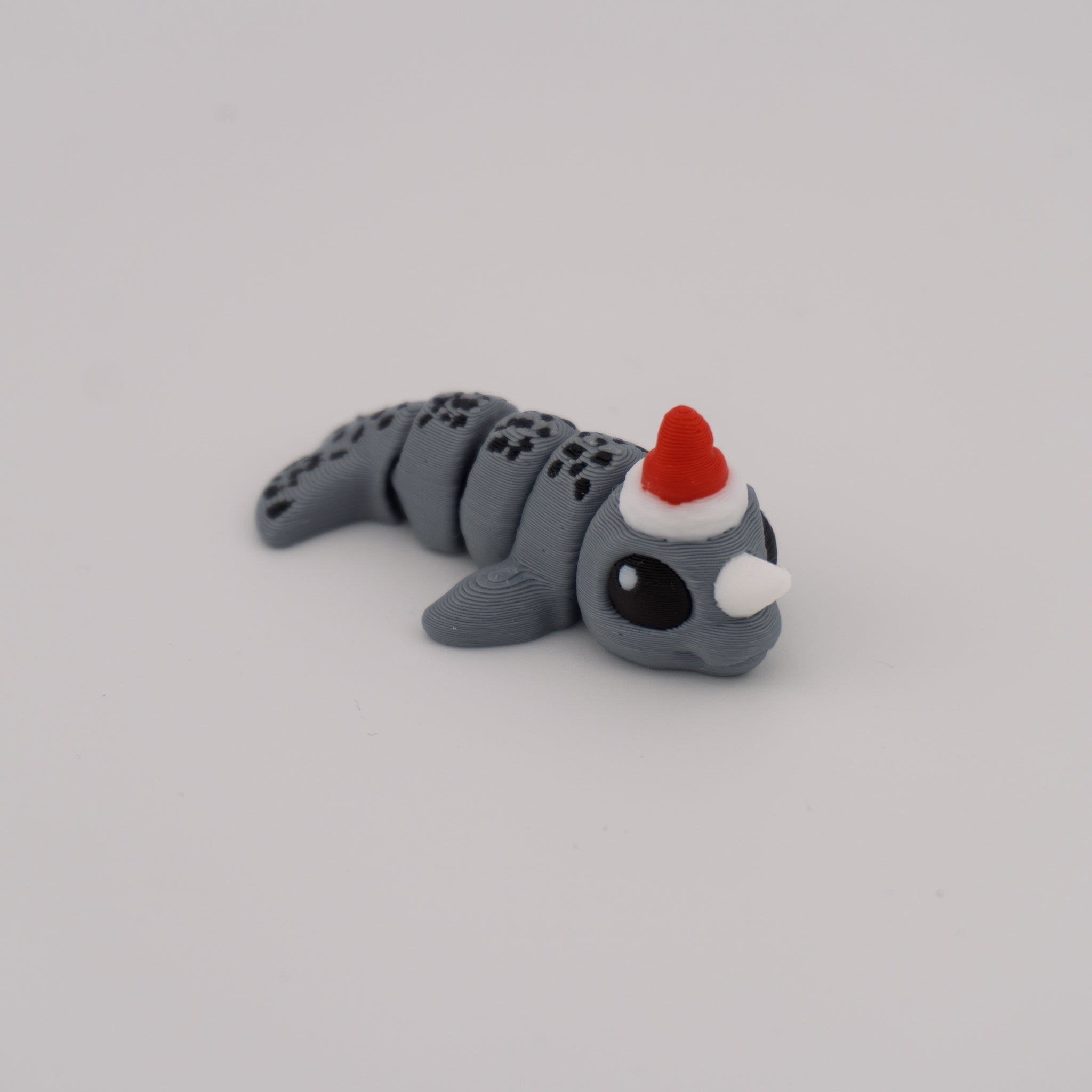 Flexi Narwhal Hatchling – Articulated Mini Sea Creature (Santa Hat or Regular)