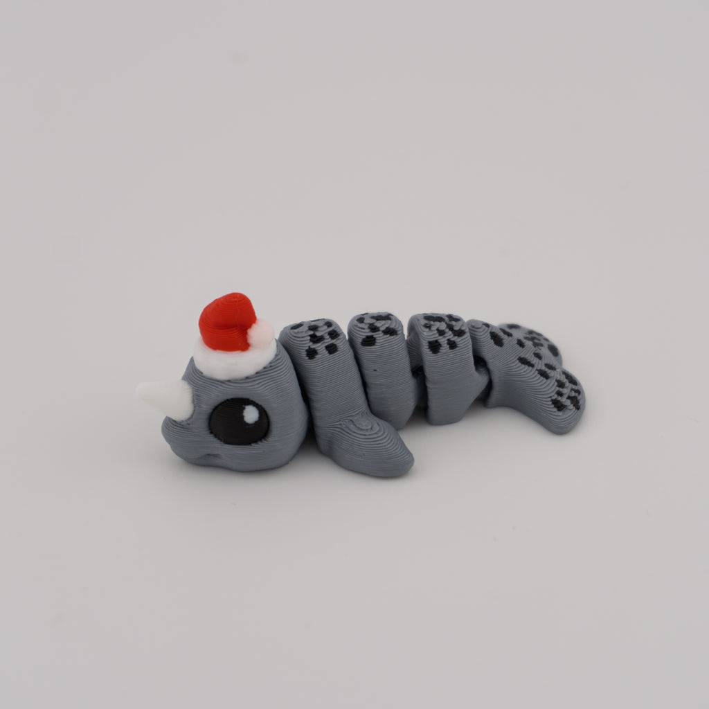 Flexi Narwhal Hatchling – Articulated Mini Sea Creature (Santa Hat or Regular)