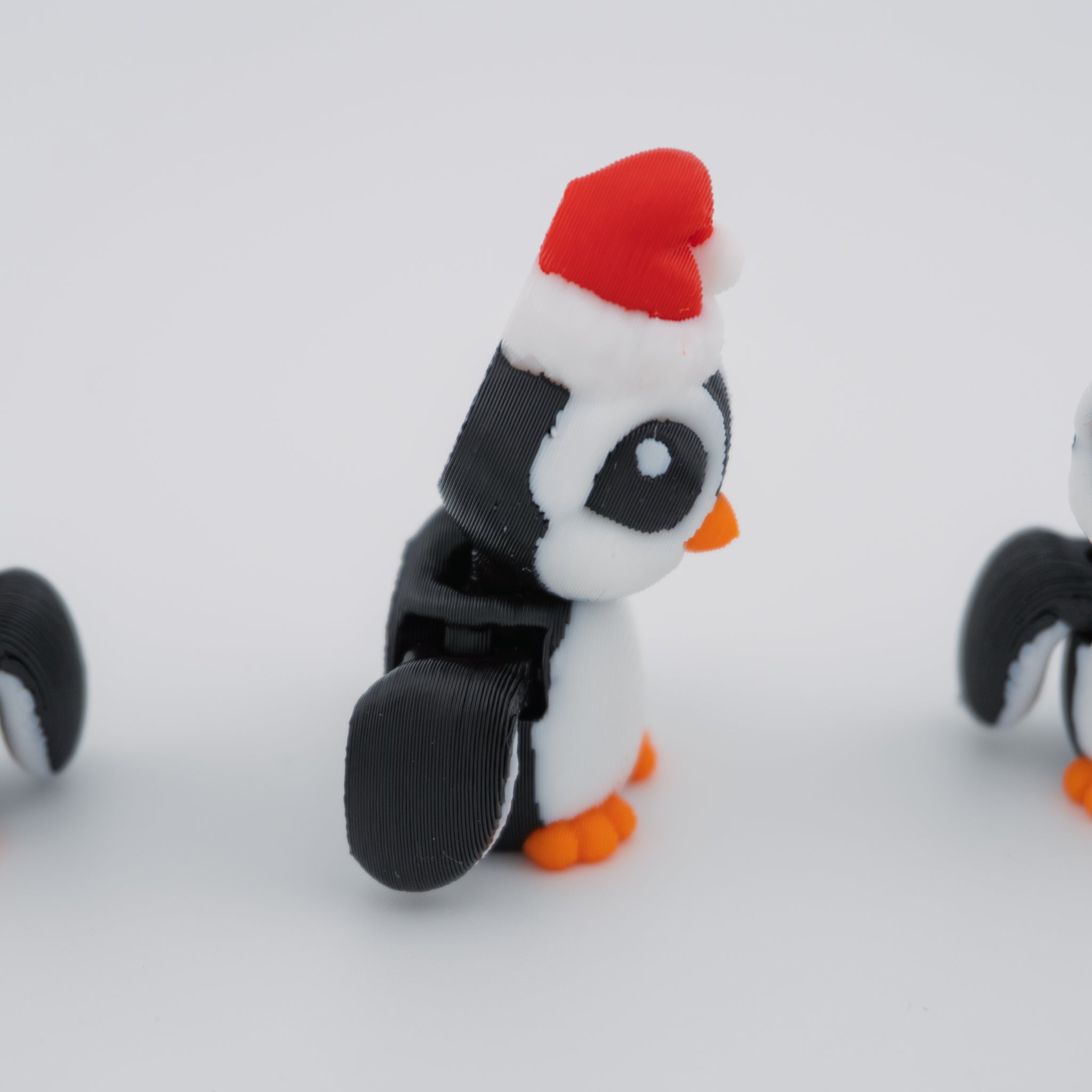 Christmas Santa Penguin Hatchling – Articulated Holiday Fidget Figure – 1.7 Inch