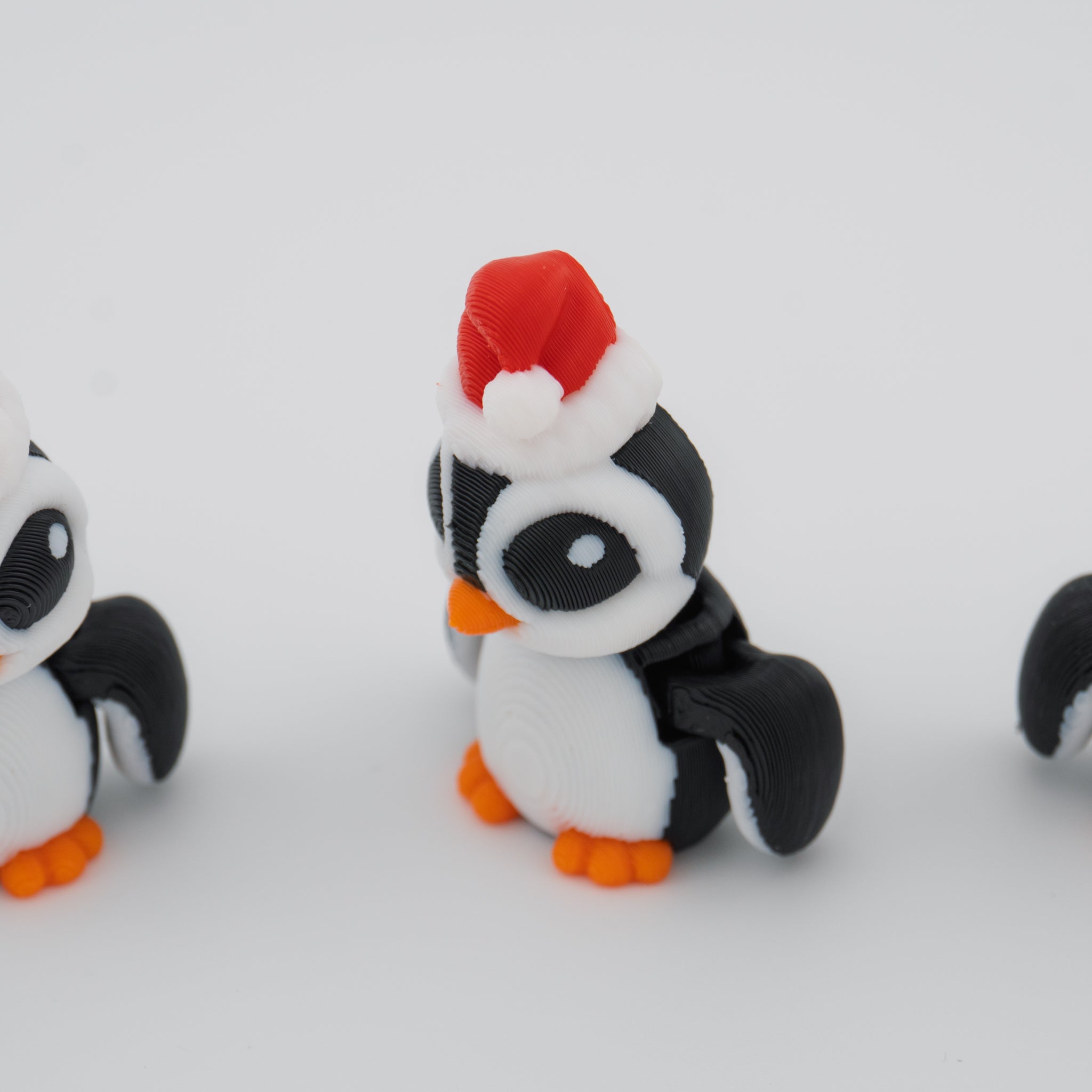 Christmas Santa Penguin Hatchling – Articulated Holiday Fidget Figure – 1.7 Inch