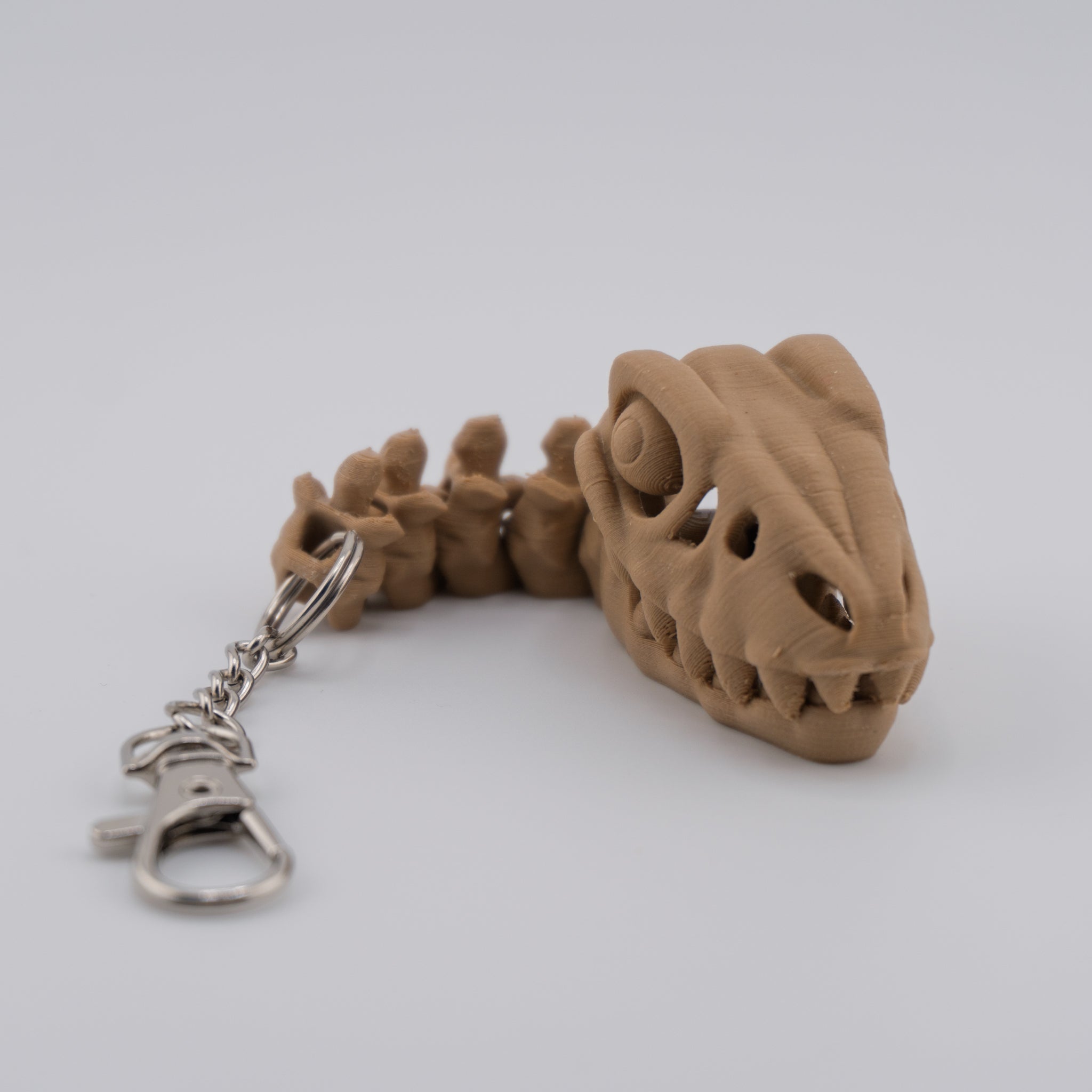 Skeleton Raptor Keychain | Mini Articulated Dino Fossil