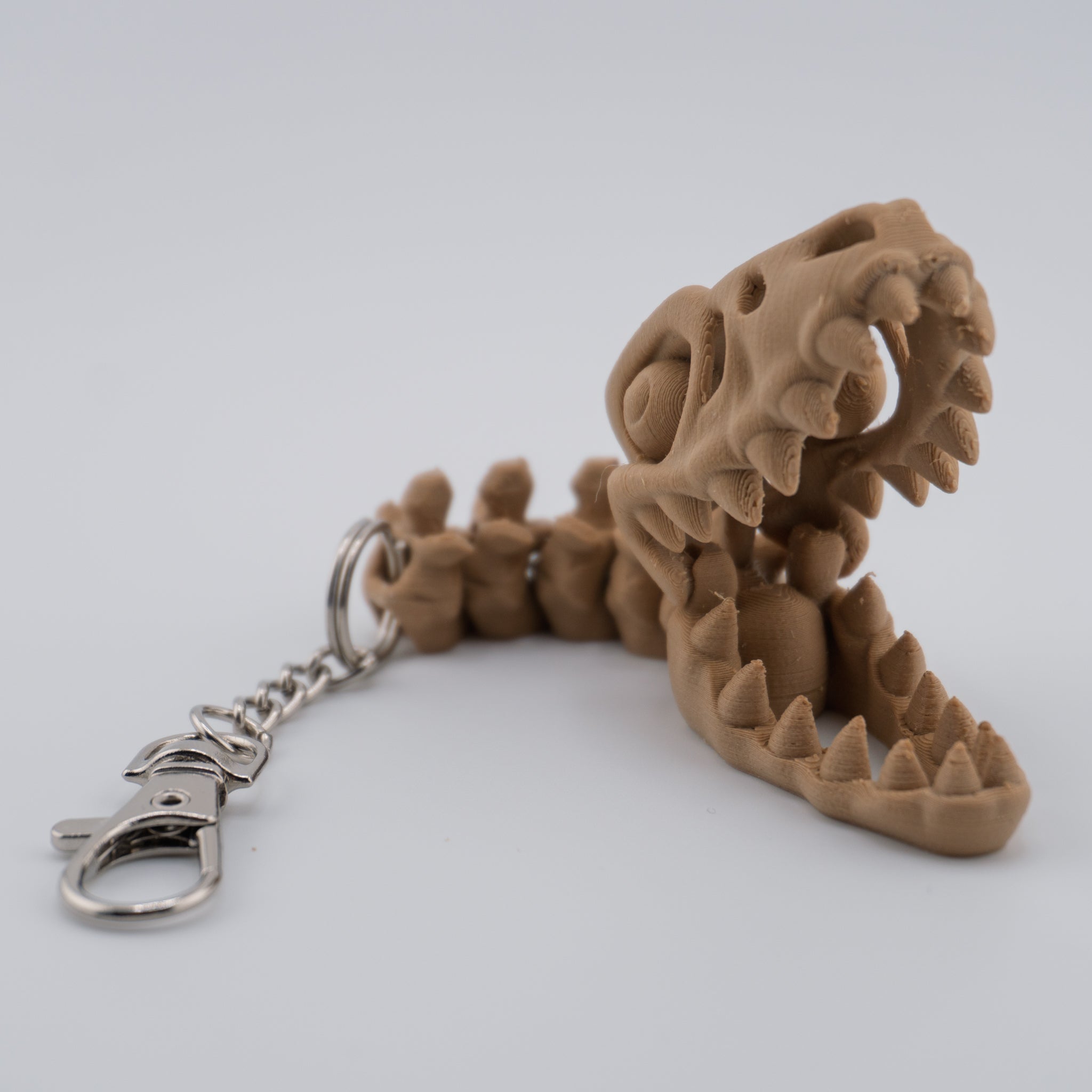 Skeleton Raptor Keychain | Mini Articulated Dino Fossil
