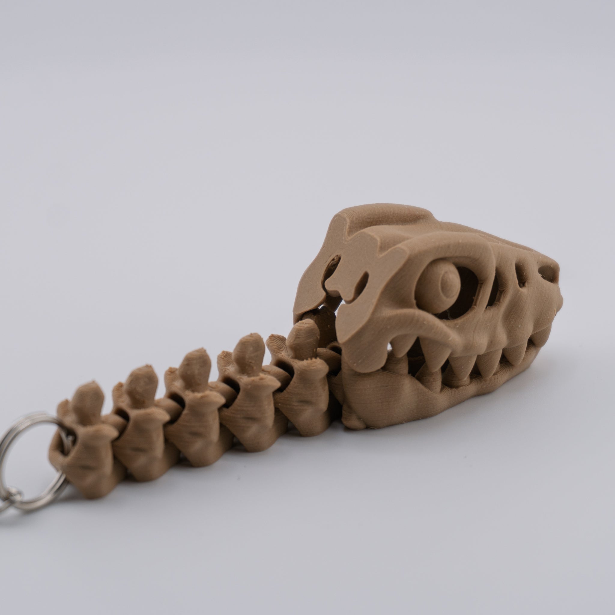 Skeleton Raptor Keychain | Mini Articulated Dino Fossil